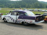 Purple and White 1955 Chevrolet Drag Car with checkered paint